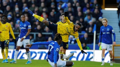Everton's Moise Kean tackles Arsenal's Alexandre Lacazette during Saturday's 0-0 draw at Goodison Park. Reuters