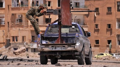 A member of the Kurdish People's Protection Units (YPG) mans a mounted machine gun in the Al Nashwa neighbourhood in the northeastern Syrian province of Hasakeh. Turkey on May 10, 2017 reacted strongly against Washington's decision to arm the rebels in their fight against ISIL. Delil Souleiman/AFP