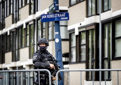 A security officer stands guard outside the court in Amsterdam-Osdorp where Taghi and others were sentenced. AFP