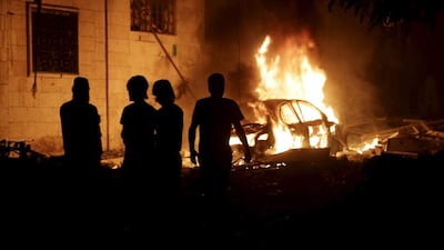 Residents inspect a site hit by what activists said was a barrel bomb dropped by forces loyal to Syria's president Bashar Al Assad in Maaret Al Naaman town in Idlib province. Khalil Ashawi / Reuters