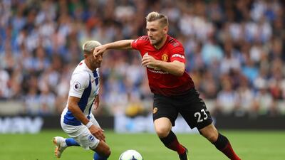 Luke Shaw runs past Anthony Knockaert. Getty