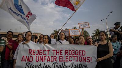 Catholic nuns take part in a protest against alleged cases of electoral fraud. Ezra Acayan / Getty