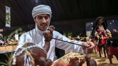 A competitor sets up his diorama