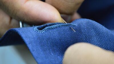 Parmar Tailors’ bespoke suit costs between Dh50,000 to Dh62,000 and comes embellished with gold buttons. Courtesy Parmar Tailors