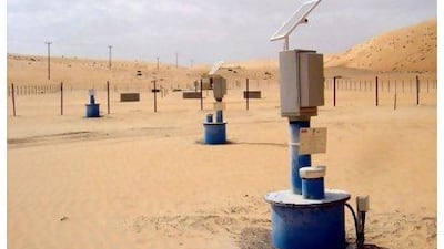 Solar panels power observation wells at a groundwater recharge pilot project in the Liwa region. Courtesy Dornier Consulting