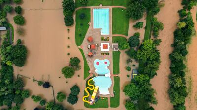 Floodwaters surround an outdoor swimming pool in the city of Leibnitz, south-eastern Austria. AFP