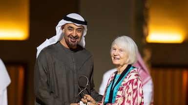 President Sheikh Mohamed with Dr Frauke Heard-Bey, who received an Abu Dhabi Award on behalf of her late husband, David Heard, at Qasr Al Hosn. Photo: UAE Presidential Court