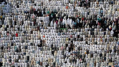 Muslim worshippers perform prayers around the Kaaba, Islam's holiest shrine, at the Grand Mosque in Saudi Arabia's holy city of Makkah. Karim Sahib / AFP