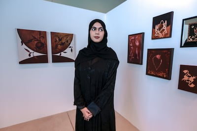 Husna Samer, the youngest artist featured in Consolidation is Reconsolidation, uses symbolism and surrealism to explore identity, remembrance and the changing meaning of home. Victor Besa / The National