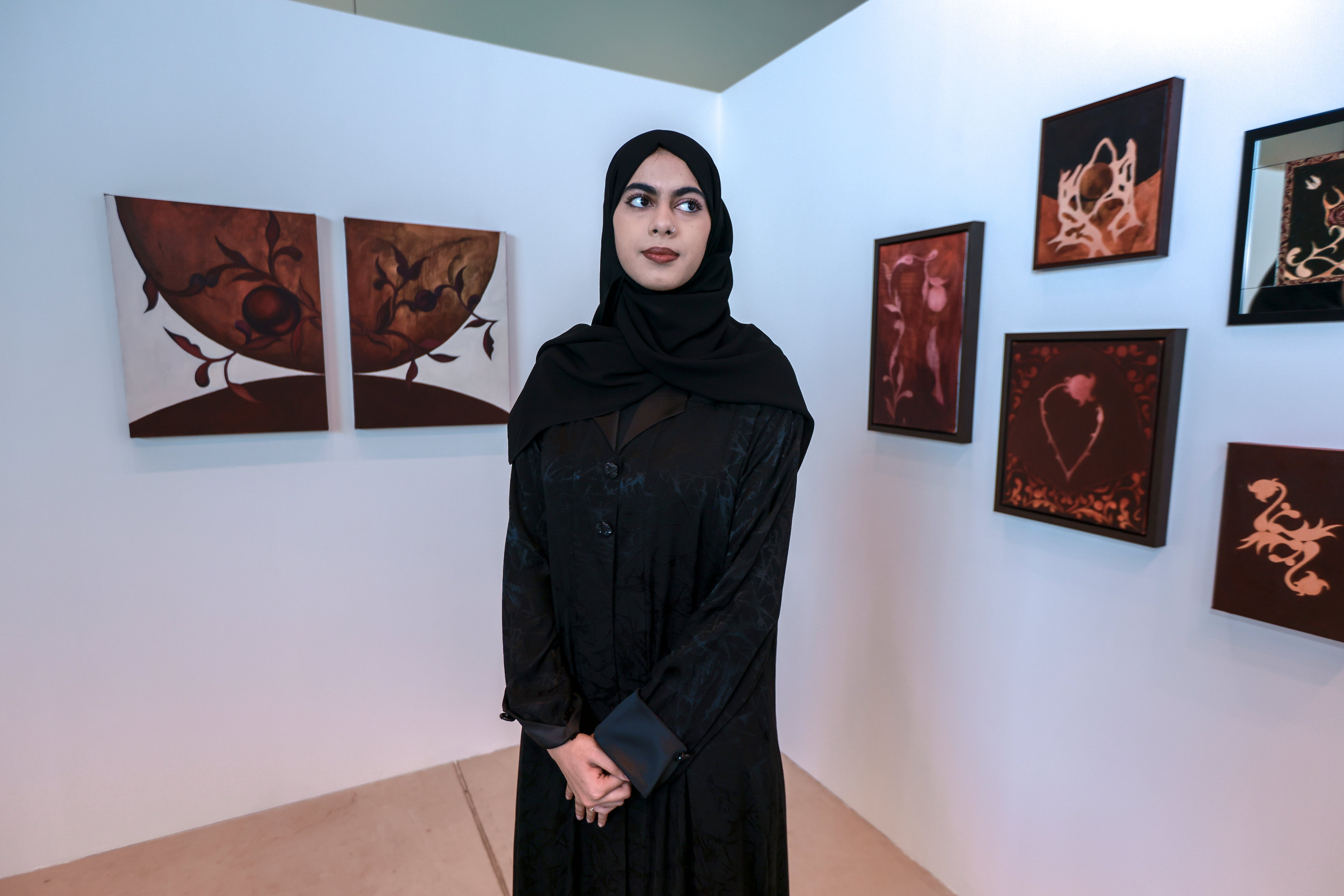 Husna Samer, the youngest artist featured in Consolidation is Reconsolidation, uses symbolism and surrealism to explore identity, remembrance and the changing meaning of home. Victor Besa / The National