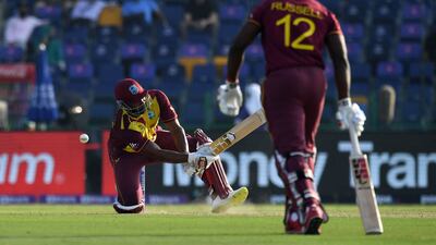 West Indies' captain Kieron Pollard falls after attempting a scoop in Abu Dhabi. AFP