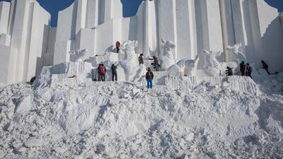 Workers prepare show sculptures. EPA