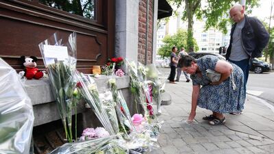 Mother of the police officer Soraya who was shot during the attack, Bernadette Hennart pays tribute to her daughter in front of the Cafe 'Les Augustins', in Liege, Belgium. Stephanie Lecocq/ EPA