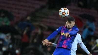 Barcelona's Austrian forward Yusuf Demir heads the ball during the Champions League Group E match against Benfica at Camp Nou on November 23, 2021. The match ended 0-0. AFP