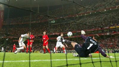 Liverpool goalkeeper Jerzy Dudek of Poland saves a shot from AC Milan forward Andriy Shevchenko in the 2005 final. Getty