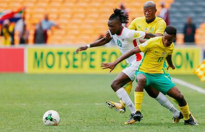 Bertrand Traore, centre, seen here playing for his country Burkina Faso in a recent 2018 World Cup qualifier, is now on the books of French club Lyon. Phill Magakoe / AFP