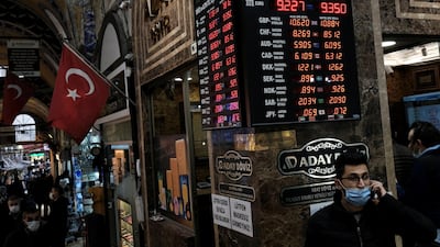A board shows the currency exchange rates outside an exchange office in Istanbul, Turkey. Reuters