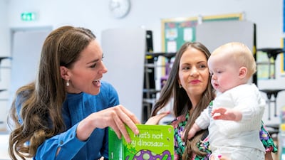 Catherine, Duchess of Cambridge, meets Laura Molloy and her 10-month-old son Saul Molloy as she take part in a "Roots of Empathy" session during a visit on Wednesday to St John's Primary School in Port Glasgow, Scotland. Reuters