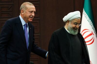 Turkish President Recep Tayyip Erdogan, left, and Iranian counterpart Hassan Rouhani are both expected to attend UNGA 2019. AFP