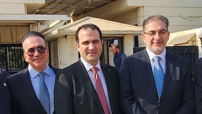 Ayham Al Ghazzy, centre, returned to the Foreign Ministry in Damascus last month. The National