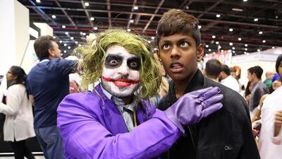 A joker visits the Middle East Film and Comic Con exhibition in Dubai World Trade Centre with a friend. Cosplay – dressing up – lends a bright and creative dimension to fan gatherings while for hardcore memorabilia fans collectibles are what it’s all about. Pawan Singh / The National