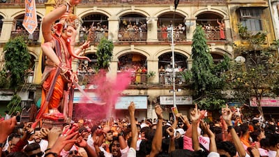 Devotees carry an idol of the Hindu deity Ganesh at a festival in Mumbai, India. Reuters