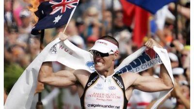 Craig Alexander celebrates after winning the Ironman World Championship triathlon for the second time in a row in 2009. Hugh Gentry / Reuters