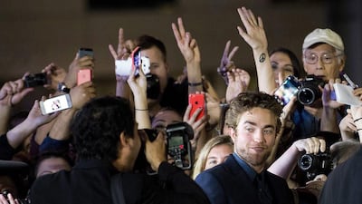 Actor Robert Pattinson poses for photographs on the red carpet for the new movie Maps To The Stars during the 2014 Toronto International Film Festival in Toronto on September 9, 2014. Nathan Denette / AP photo