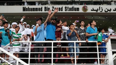 Fans flock to the Mohammed Bin Zayed Stadium in Abu Dhabi on May 14, 2014, for an open training session by English Premier League champions Manchester City. Christopher Pike / The National