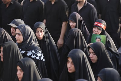 Mourners gather in Qom on Tuesday to attend a funeral procession for Iran's late supreme leader Ayatollah Ali Khamenei. Reuters