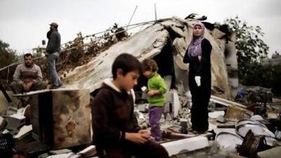 Members of the Al Attar family, displaced during the eight-day conflict with Israel, return to their home in the northern Gaza Strip a day after a ceasefire took hold in and around Gaza.