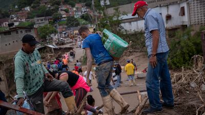 The streets of Tejerias were filled with mud, boulders and tangled tree branches. EPA