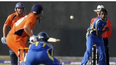 Ajantha Mendis, right, bowled Sri Lanka to a 156-run victory over the Netherlands yesterday. Ishara S Kodikara / AFP