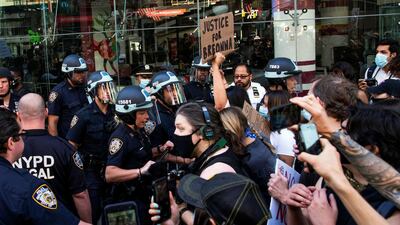 Demonstrators scuffle with police officers as they try to march through Times Square during a protest against racial inequality in the aftermath of the death in Minneapolis police custody of George Floyd, in New York City, New York, on June 14, 2020. Reuters