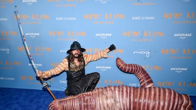 Quite the catch. Klum's husband Tom Kaulitz dressed as a fisherman. Invision / AP