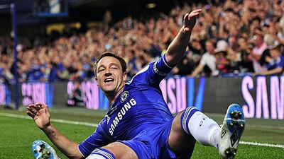 John Terry, the Chelsea captain, attempts to recreate on of Chelsea's famous team celebrations in the 1990s, but forgot to tell everyone after he scored in their 3-1 win against Everton. Glyn Kirk / AFP Photo