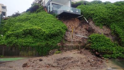 A house is seen after a landslip took out part of its foundation, forcing the road to be closed in Shortland esplanade, Newcastle, New South Wales. EPA