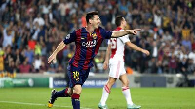 Lionel Messi celebrates after scoring a goal against Ajax in the Champions League on Tuesday night in Barcelona. Stanley Gontha / EPA / October 21, 2014