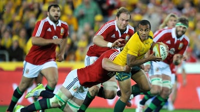Australian Wallabies' Will Genia, centre, and his team mates will be in action during the end of the season to prepare for the 2015 World Cup in England. EPA/PAUL MILLER