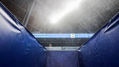 Rain falls into the mostly covered Louis Armstrong Stadium on the third day of the US Open Tennis Championships in New York. EPA