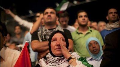 A Palestinian woman cries in Ramallah, West Bank, during the speech of President Mahmoud Abbas at the UN General Assembly.