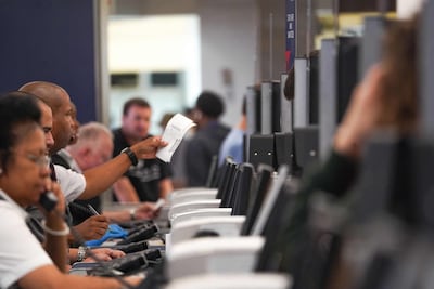 US airlines have issued travel waivers for passengers impacted by the global IT outage. AFP