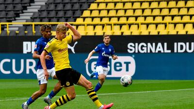 Dortmund's Erling Braut Haaland scores the opening goal against Schalke. AFP
