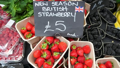 Food prices are displayed at London's Borough Market. UK inflation has fallen to 2 per cent. Reuters
