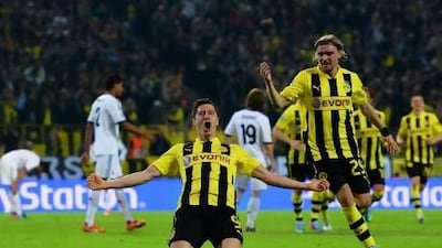 DORTMUND, GERMANY - APRIL 24: Robert Lewandowski of Borussia Dortmund celebrates after scoring his team's third goal during the UEFA Champions League semi final first leg match between Borussia Dortmund and Real Madrid at Signal Iduna Park on April 24, 2013 in Dortmund, Germany. (Photo by Lars Baron/Bongarts/Getty Images) *** Local Caption *** 167335186.jpg