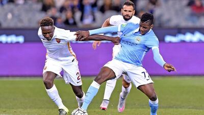 Kelechi Iheanacho of Manchester City vies for the ball with AS Roma's Mapou Yanga-Mbiwa on Tuesday during their pre-season friendly for the International Champions Cup. Joe Castro / EPA