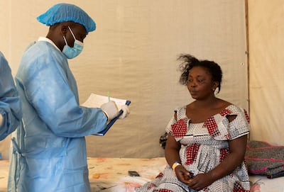A woman is assessed by a medical worker at the health centre near Goma, DR Congo. Reuters