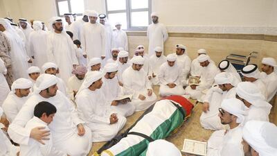 Quran is read over the body of Captain Hadif Al Shamsi in Martyrs’ Mosque in Al Ain. Al Ittihad