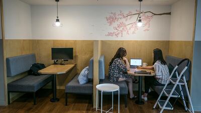 Employees work at their office. There are several ways to boost the chances of success for your business. Jean Chung/Bloomberg