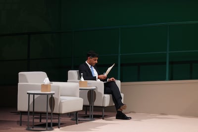 Rishi Sunak sits alone as he prepares to speak at Cop28. Getty Images